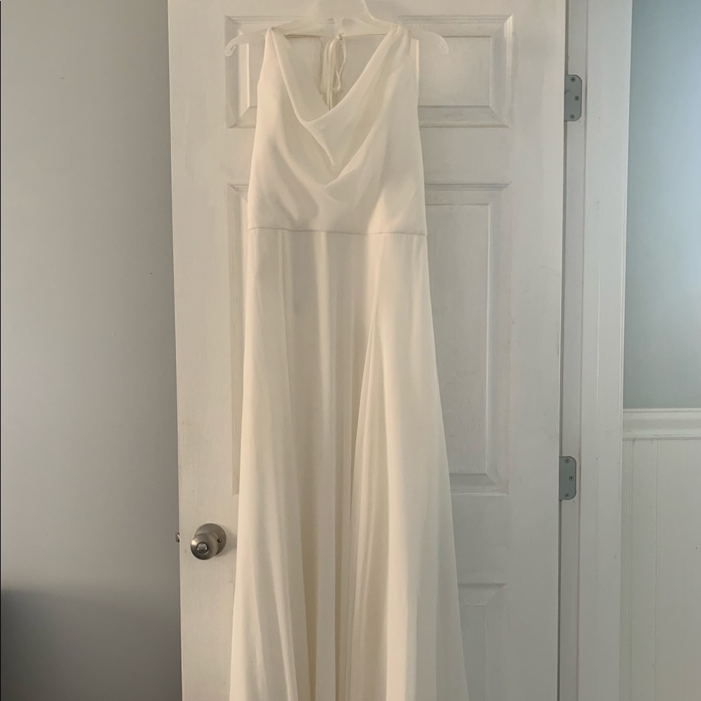 A Gamberdella, floor length, paper white dress.